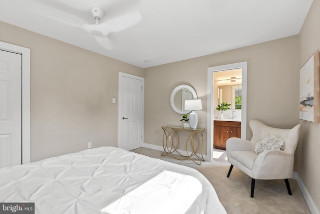 8620 Conover Pl, Alexandria, VA 22308 - bedroom featuring light carpet, baseboards, a sink, and connected bathroom