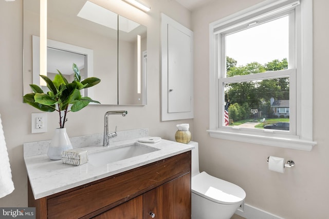 8620 Conover Pl, Alexandria, VA 22308 - half bathroom featuring vanity, toilet, and baseboards