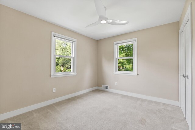 8620 Conover Pl, Alexandria, VA 22308 - spare room with healthy amount of natural light, baseboards, light carpet, and ceiling fan