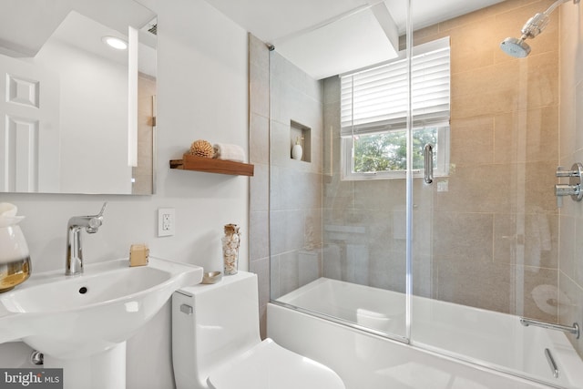 8620 Conover Pl, Alexandria, VA 22308 - full bathroom featuring a sink, combined bath / shower with glass door, and toilet