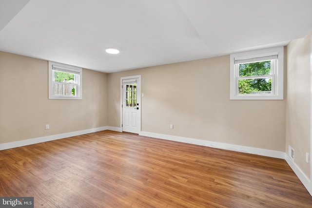 8620 Conover Pl, Alexandria, VA 22308 - empty room featuring light wood-style flooring, baseboards, and plenty of natural light