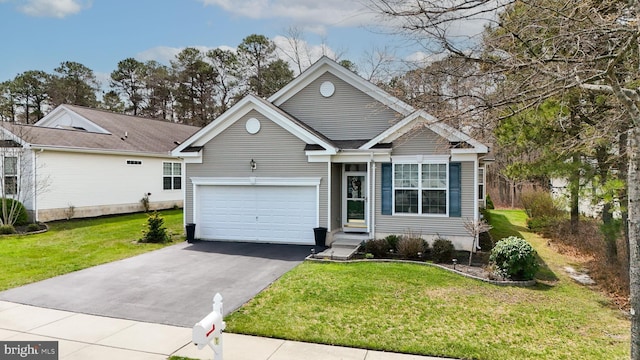 166 Blackburn St, Absecon, NJ 08205 - view of front of house with an attached garage, aphalt driveway, and a front yard