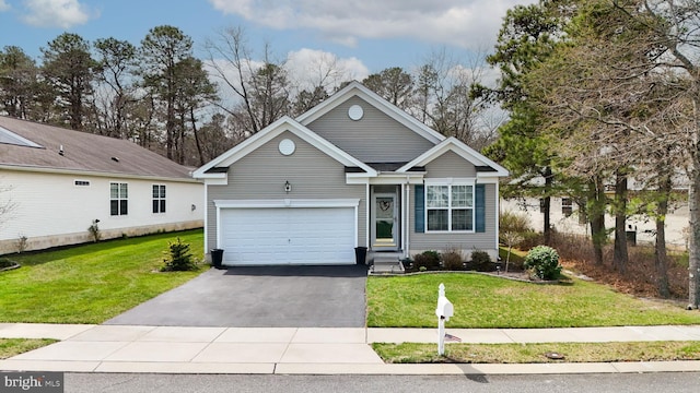 166 Blackburn St, Absecon, NJ 08205 - view of front of house with an attached garage, a front lawn, and aphalt driveway