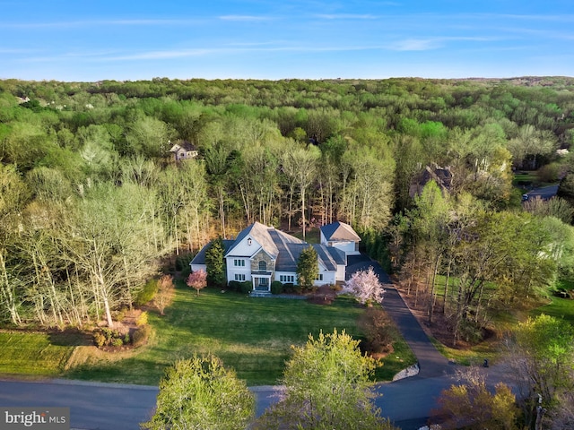 view from above of property featuring a forest