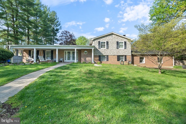 13108 Manor Dr, Mount Airy, MD 21771 - tri-level home featuring french doors, a front yard, and brick siding