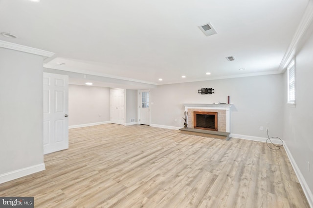 13108 Manor Dr, Mount Airy, MD 21771 - unfurnished living room with crown molding, light wood-style flooring, a brick fireplace, baseboards, and recessed lighting