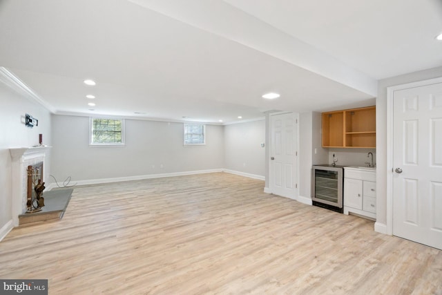 13108 Manor Dr, Mount Airy, MD 21771 - unfurnished living room featuring wine cooler, wet bar, light wood-style flooring, baseboards, and recessed lighting