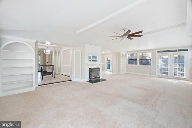 13108 Manor Dr, Mount Airy, MD 21771 - unfurnished living room with a ceiling fan, carpet floors, a fireplace with flush hearth, built in shelves, and baseboards