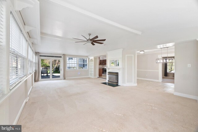 13108 Manor Dr, Mount Airy, MD 21771 - unfurnished living room featuring light colored carpet, a premium fireplace, a ceiling fan, baseboards, and a chandelier