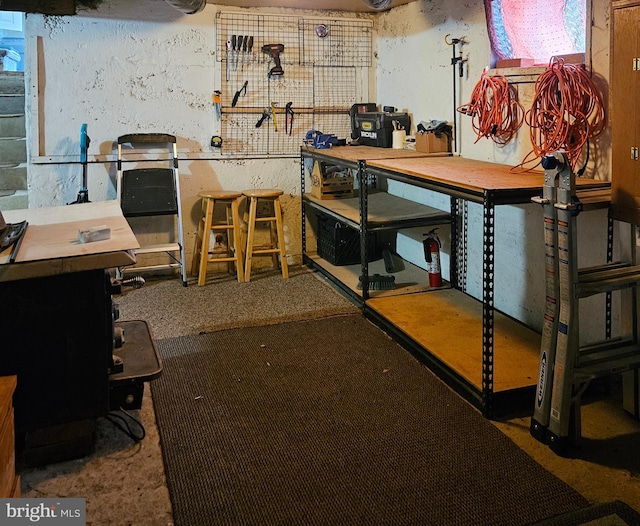 unfinished basement with a workshop area