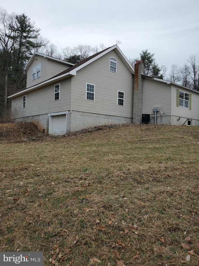 6335 Oxford Rd, Gardners, PA 17324 - view of side of property featuring an attached garage, a chimney, and a lawn