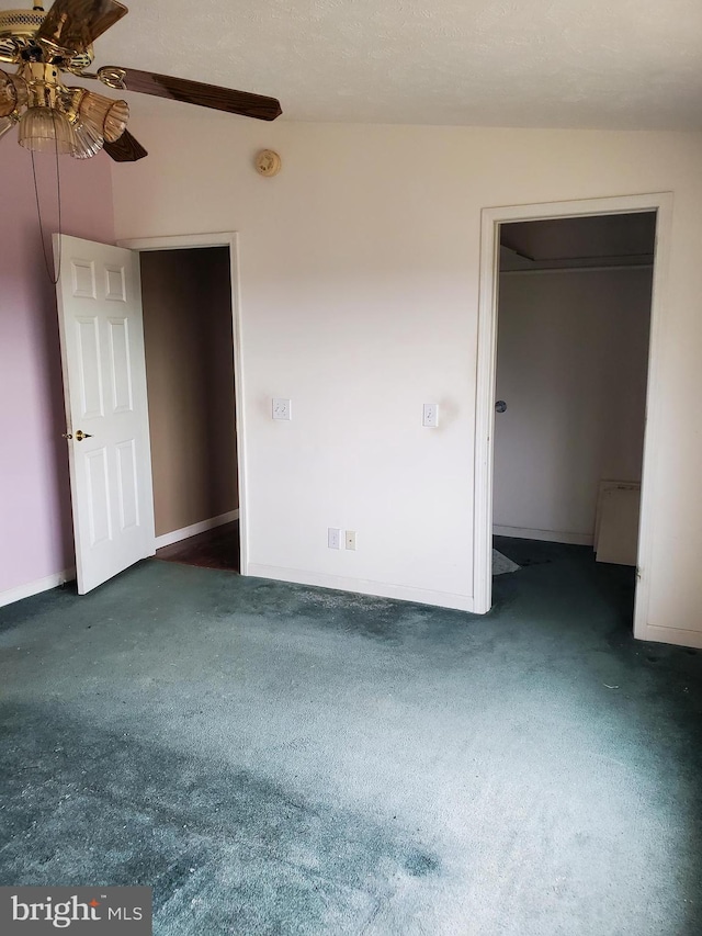 6335 Oxford Rd, Gardners, PA 17324 - unfurnished bedroom featuring a walk in closet, baseboards, a ceiling fan, and carpet floors