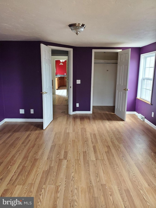 6335 Oxford Rd, Gardners, PA 17324 - unfurnished bedroom featuring light wood-style floors, a closet, baseboards, and visible vents
