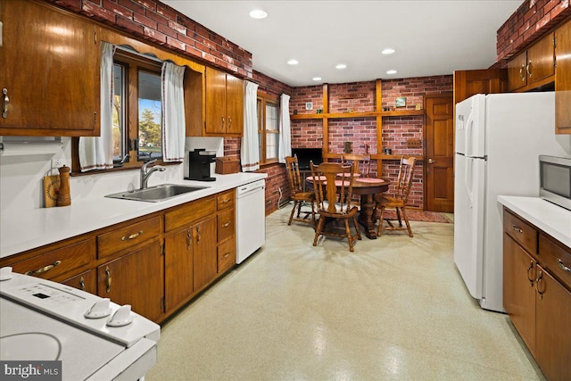 6 Mckonkey Way, Titusville, NJ 08560 - kitchen with light countertops, a sink, brick wall, and white appliances