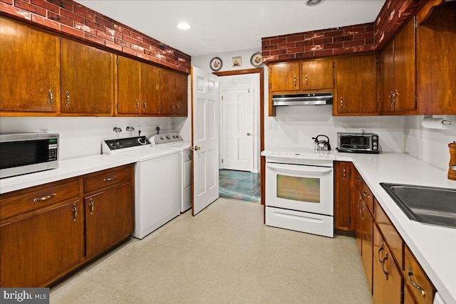 6 Mckonkey Way, Titusville, NJ 08560 - kitchen featuring washer and clothes dryer, white electric range oven, under cabinet range hood, and light floors