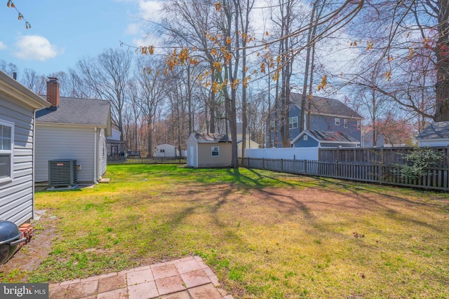 5984 2nd St, Deale, MD 20751 - view of yard with a fenced backyard, an outdoor structure, and central air condition unit