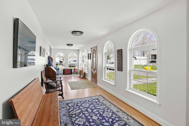 5984 2nd St, Deale, MD 20751 - hallway featuring a wealth of natural light, wood finished floors, and baseboards