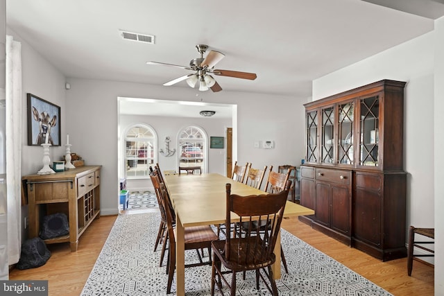 5984 2nd St, Deale, MD 20751 - dining area with light wood-type flooring, visible vents, and a ceiling fan