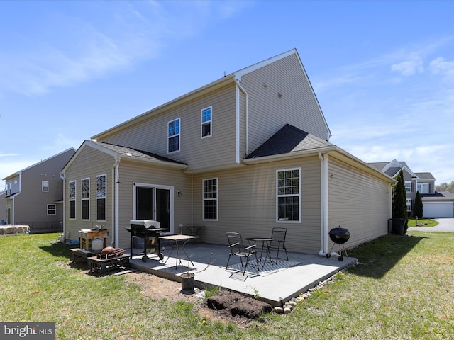 back of property with a patio area and a lawn