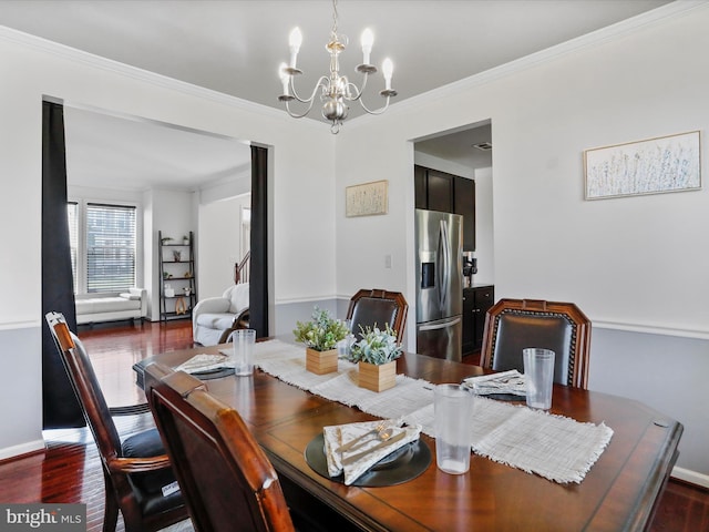 dining area featuring baseboards, a notable chandelier, crown molding, and dark wood-style floors