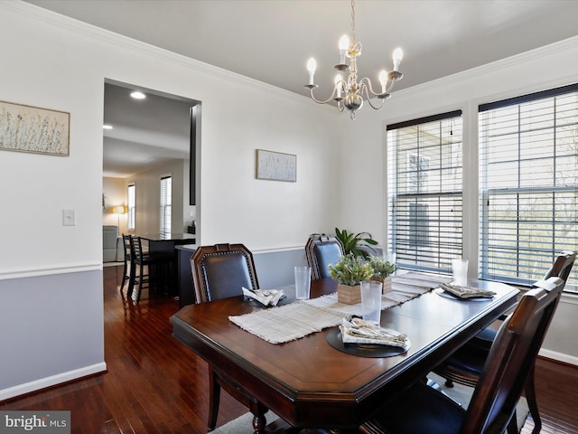 dining area with baseboards, recessed lighting, a chandelier, wood finished floors, and ornamental molding