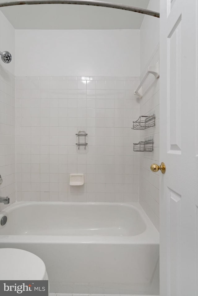 full bath featuring washtub / shower combination and toilet