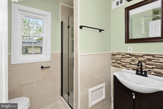 115 Glendale Dr, Ewing, NJ 08618 - bathroom featuring tile walls, a stall shower, vanity, a wainscoted wall, and toilet