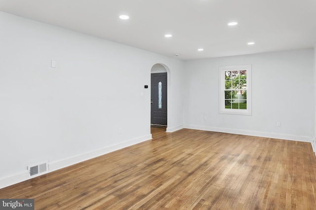 115 Glendale Dr, Ewing, NJ 08618 - empty room featuring arched walkways, wood finished floors, baseboards, and recessed lighting