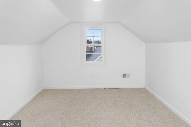 115 Glendale Dr, Ewing, NJ 08618 - additional living space with carpet floors, lofted ceiling, and baseboards