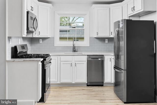 115 Glendale Dr, Ewing, NJ 08618 - kitchen featuring stainless steel appliances, a sink, light countertops, and white cabinetry
