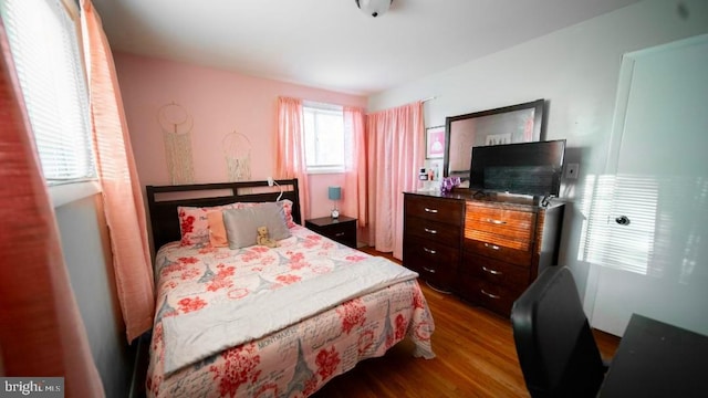 bedroom featuring dark wood-style floors