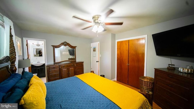 bedroom featuring a ceiling fan, a closet, and wood finished floors