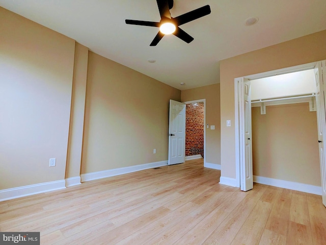 1102 S Carey St, Baltimore, MD 21223 - unfurnished bedroom featuring light wood-type flooring, baseboards, ceiling fan, and a closet