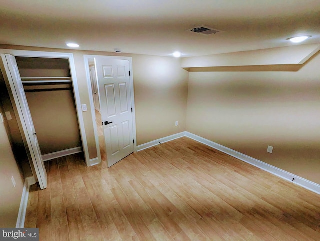 1102 S Carey St, Baltimore, MD 21223 - unfurnished bedroom with wood finished floors, baseboards, recessed lighting, and a closet