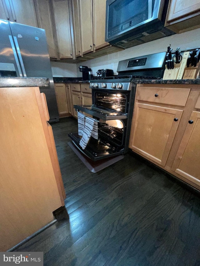 506 Victorianna Dr, Capitol Heights, MD 20743 - kitchen with dark countertops, stainless steel appliances, and dark wood-type flooring