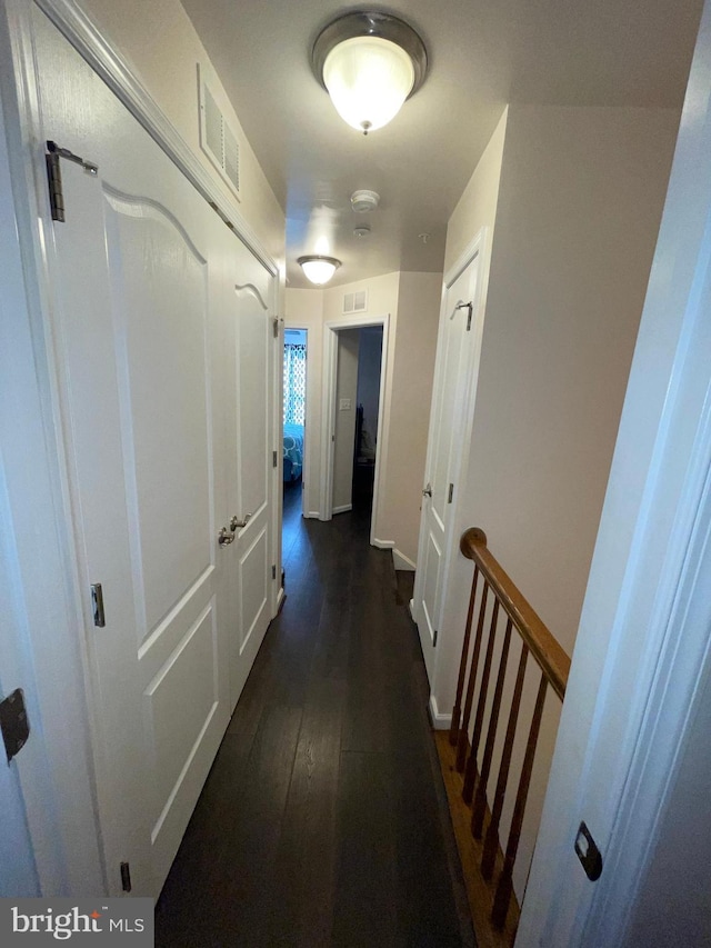 506 Victorianna Dr, Capitol Heights, MD 20743 - corridor with baseboards, visible vents, and dark wood-style flooring