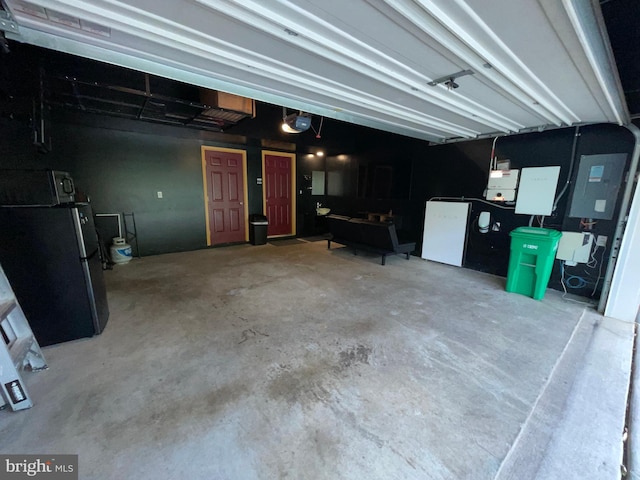 506 Victorianna Dr, Capitol Heights, MD 20743 - garage with freestanding refrigerator, electric panel, and a garage door opener