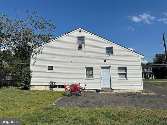 502 N W Ave, Vineland, NJ 08360 - rear view of house with cooling unit, a yard, fence, and entry steps