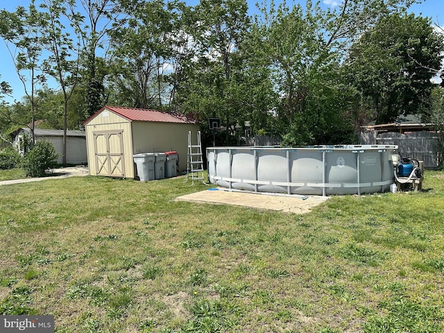 502 N W Ave, Vineland, NJ 08360 - view of yard featuring an outdoor structure, an outdoor pool, a storage shed, and fence