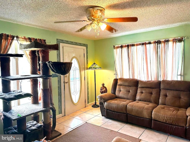 502 N W Ave, Vineland, NJ 08360 - living area with light tile patterned flooring, a textured ceiling, and a ceiling fan