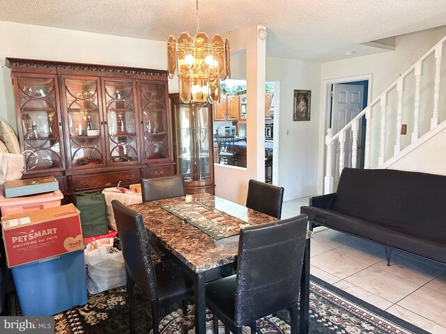 502 N W Ave, Vineland, NJ 08360 - tiled dining space featuring an inviting chandelier, a textured ceiling, and stairs
