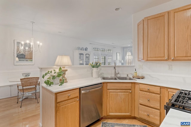3329 Turnberry Cir, Charlottesville, VA 22911 - kitchen featuring dishwasher, light countertops, a sink, a notable chandelier, and black gas range