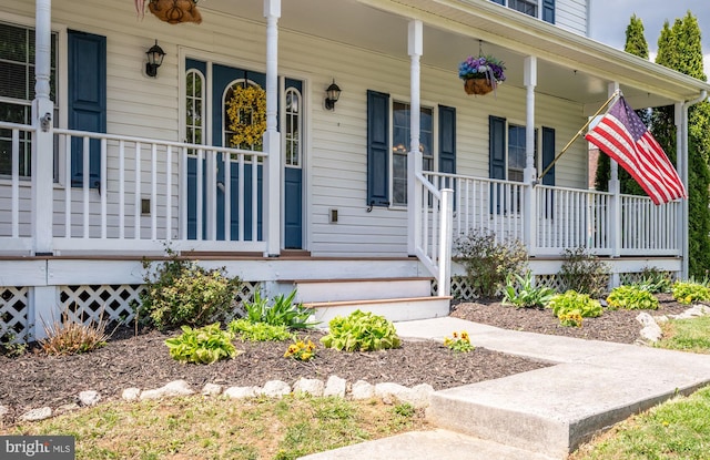 doorway to property with a porch