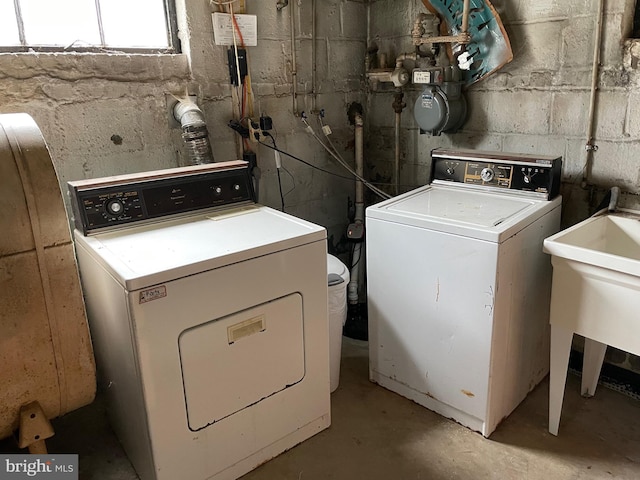 washroom featuring independent washer and dryer and laundry area