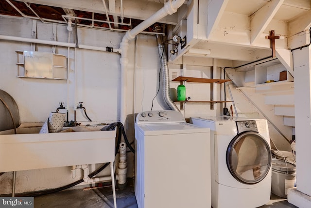 washroom featuring laundry area and washing machine and dryer