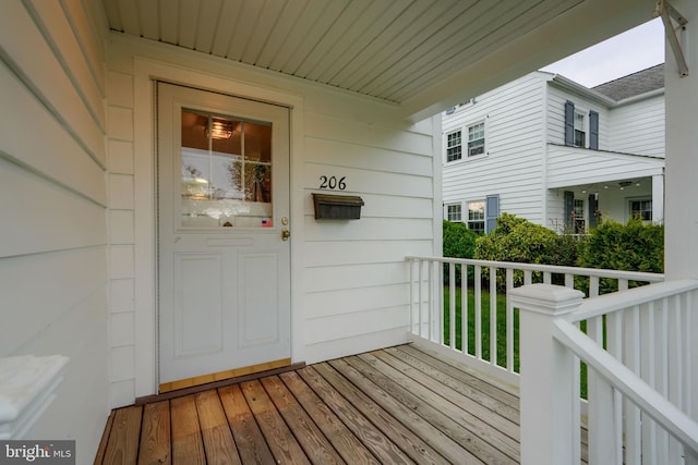 wooden terrace featuring covered porch