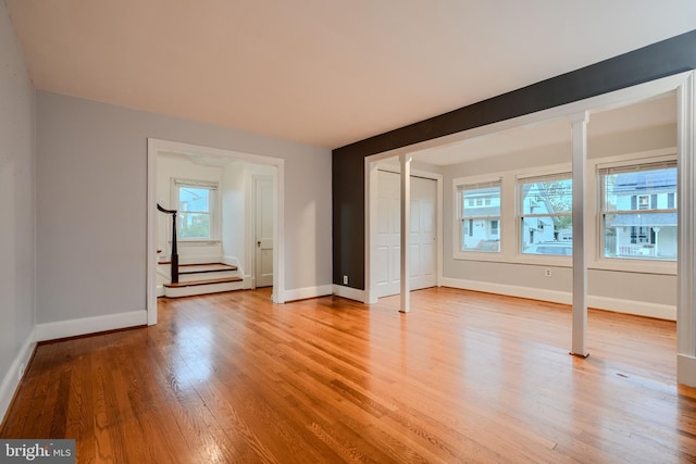 unfurnished bedroom featuring baseboards and light wood finished floors