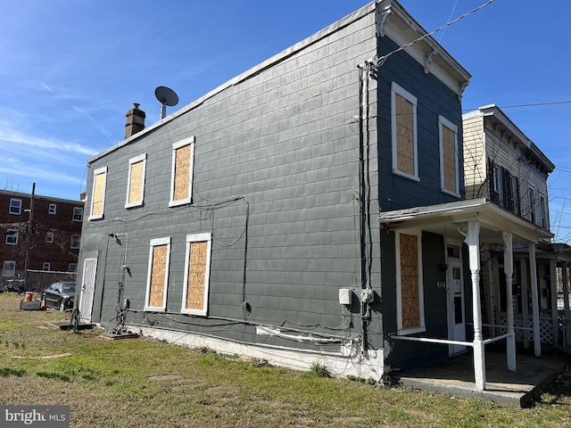 2109 Fairlawn Ave SE, Washington, DC 20020 - rear view of property featuring a chimney and a lawn