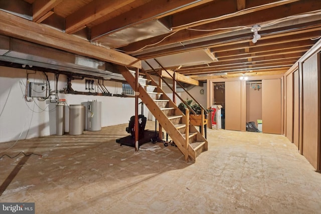 unfinished below grade area with water heater and stairway