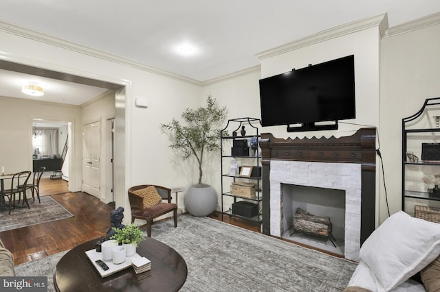 1240 Leopard St, Philadelphia, PA 19125 - living area featuring a fireplace, baseboards, ornamental molding, and wood finished floors